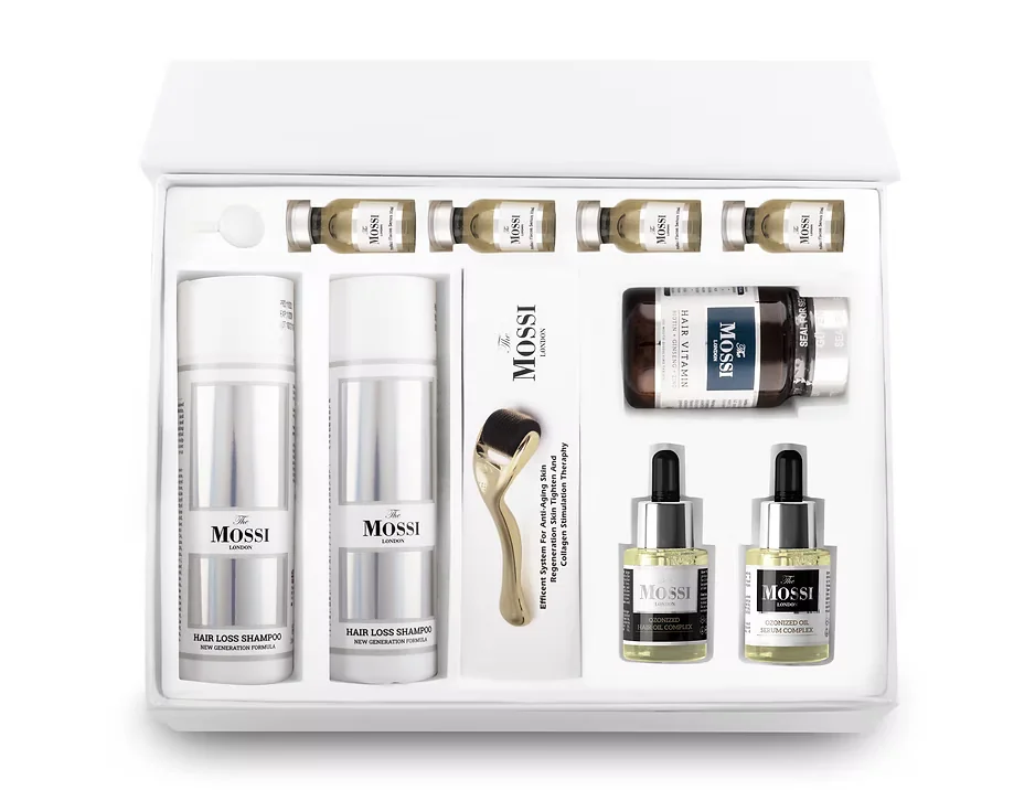 Coffret complet de soins capillaires "The Mossi London" comprenant des shampoings anti-chute, des vitamines, des sérums et un dermaroller, proposé par Renaissance Clinique pour le traitement et la santé des cheveux.